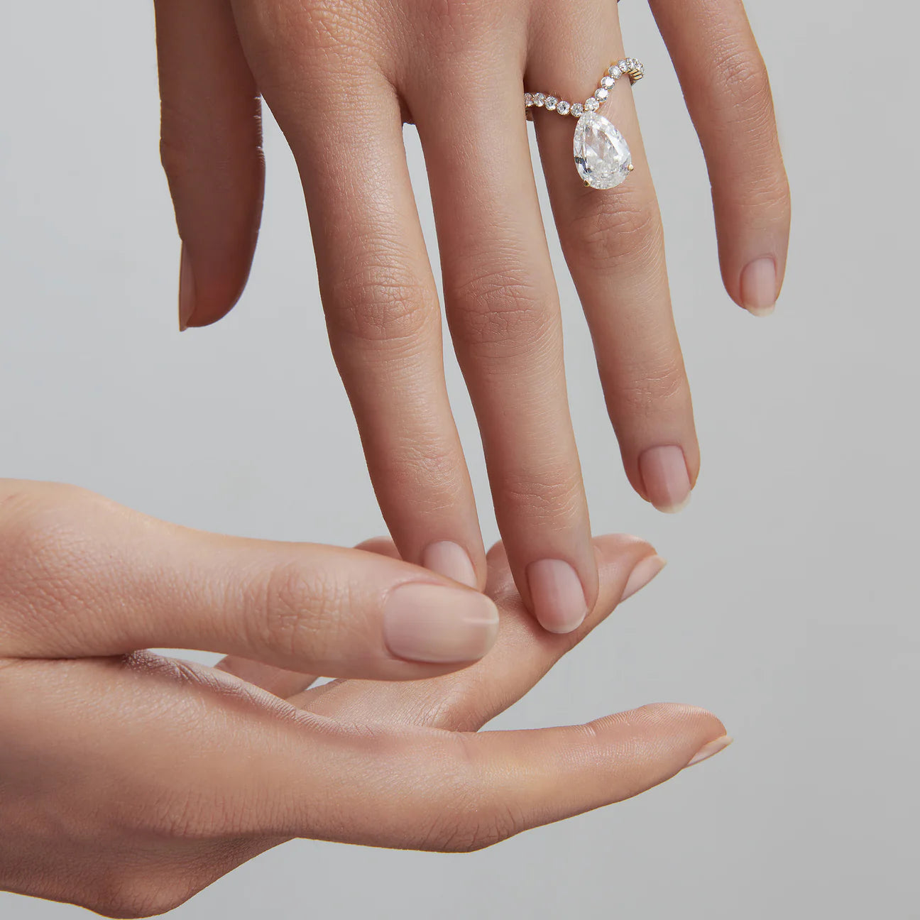 Tear curve diamond ring