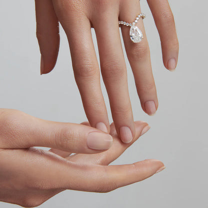 Tear curve diamond ring